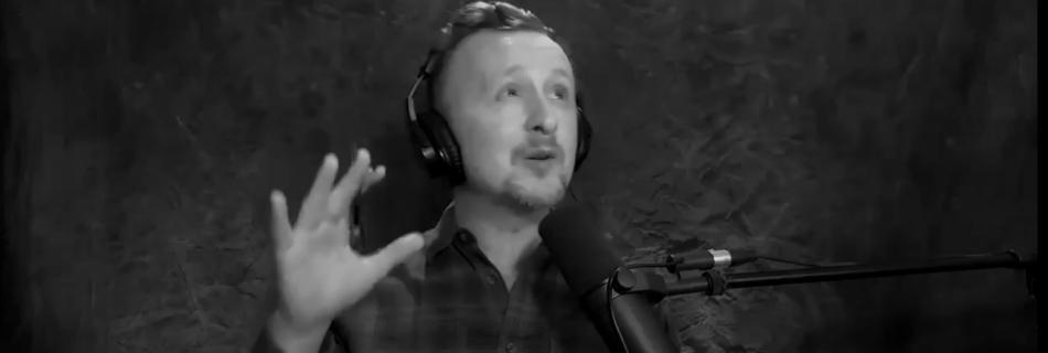 Actor Paul Cram looking towards the sky while talking into a microphone